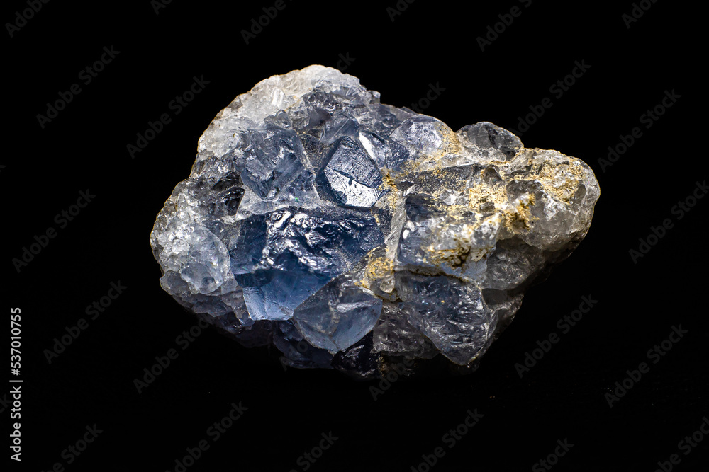Real light blue celestine crystal cluster isolated on black background with no shadows
