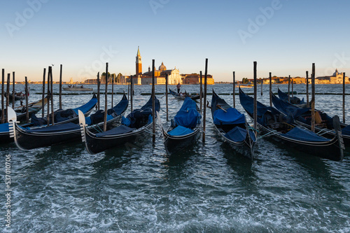 a group of gondolas on the grand canal in Venice at sunset © Obatala-photography