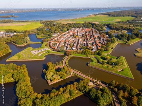 High angle Drone Point of View on the Fortified City of Naarden, North-Holland, Netherlands on sunny autumn day. Naarden was granted its city rights in 1300.