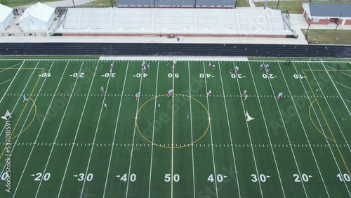 4K aerial of a typical American high school football field during lacrosse team practice photo
