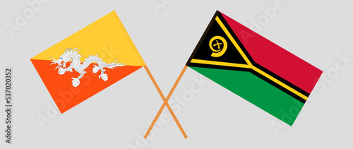 Crossed flags of Bhutan and Vanuatu. Official colors. Correct proportion