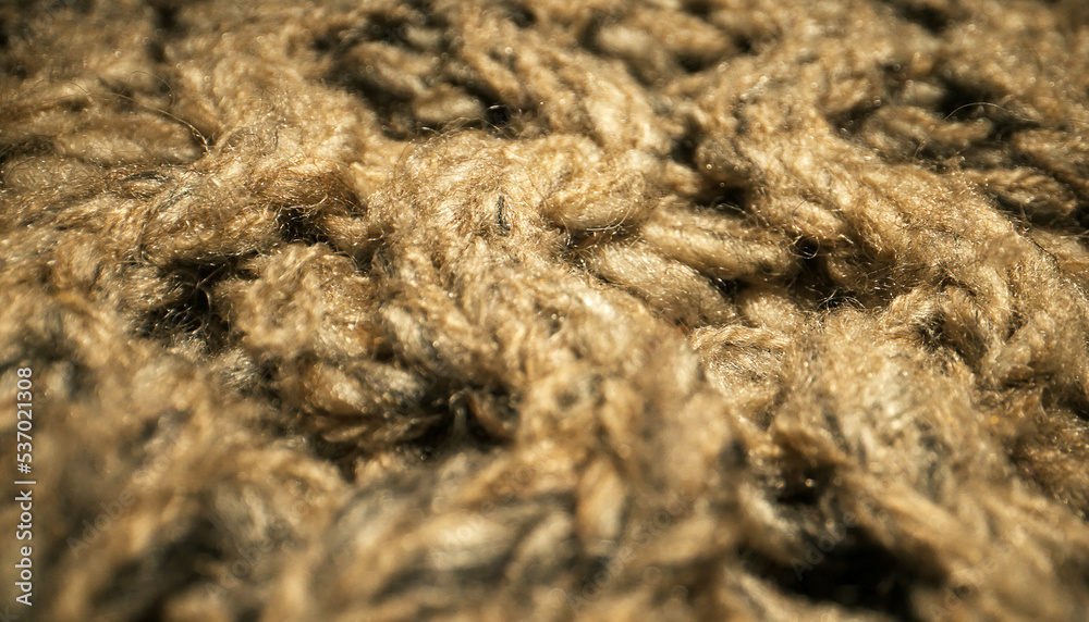 Knitted warm wool fabric texture. Close-up. Knitted warm wool fabric texture. Close-up.