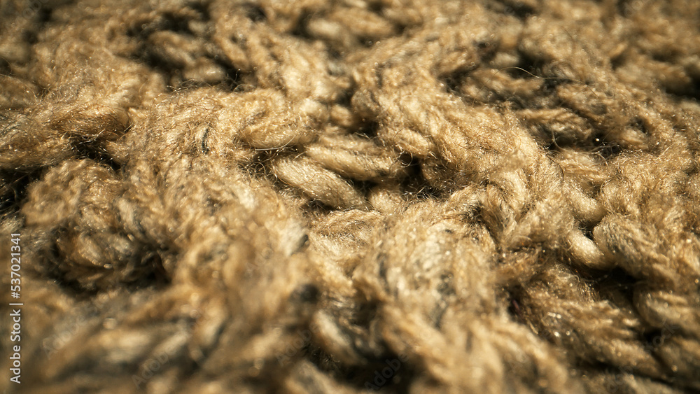 Knitted warm wool fabric texture. Close-up.