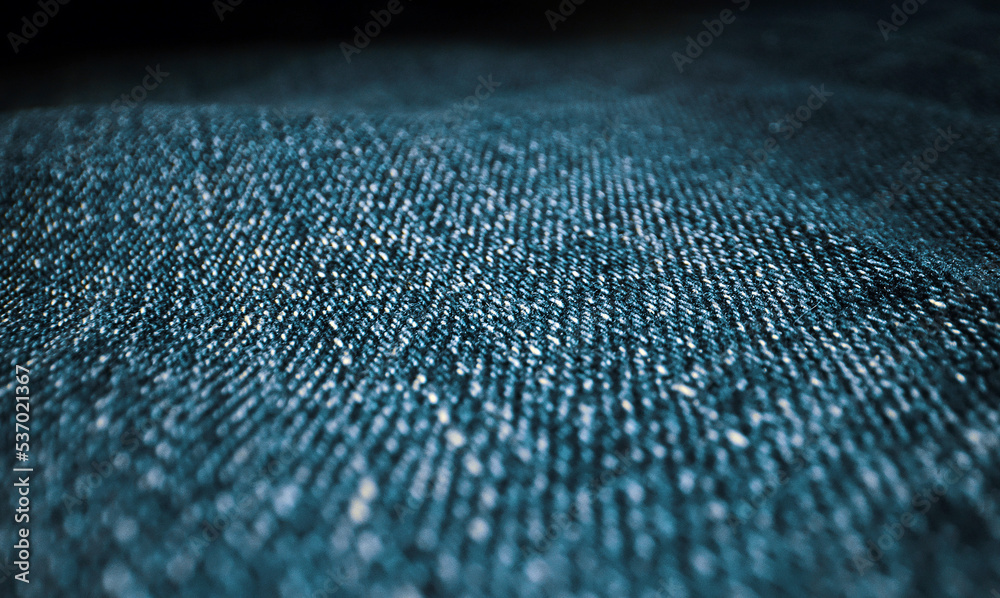 Denim blue jeans fabric texture. Close-up.