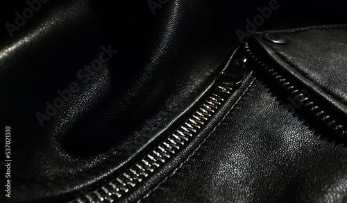 Black leather jacket details. Close-up.