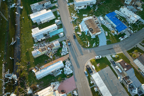 Severely damaged by hurricane Ian houses in Florida mobile home residential area. Consequences of natural disaster