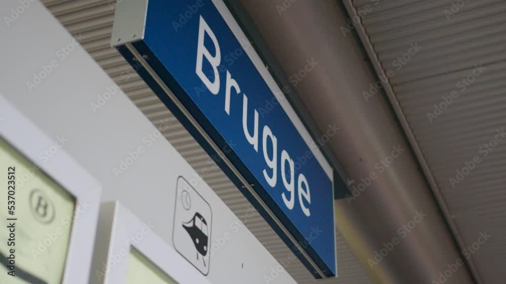 Brugge name sign at the railway station. The city of Bruges in Belgium is a popular tourist destination Brugge name sign at the railway station. The city of Bruges in Belgium is a popular tourist destination