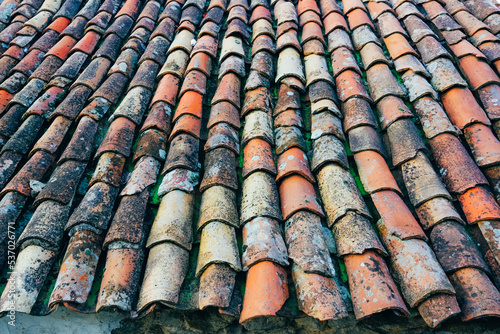 Terracotta brick roof tiles close up © Marina
