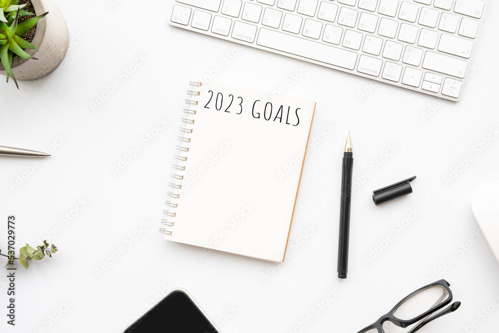 Notebook with 2023 goals text on it to apply new year resolutions and plan. Notebook with 2023 goals text on it to apply new year resolutions and plan.