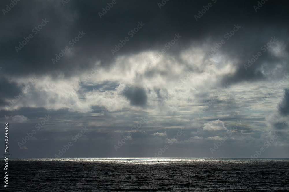 Incredible storm at sea. Sun rays breaking through the clouds. Incredible storm at sea. Sun rays breaking through the clouds.