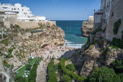 Spectacular houses of the old town of Polignano a Mare built on the cliffs above the Adriatic Sea view from the sea on a beautiful sunny day
