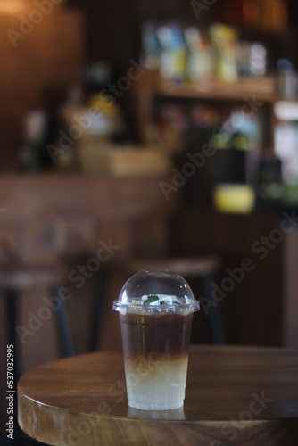 A cup of ice amaricano on the table