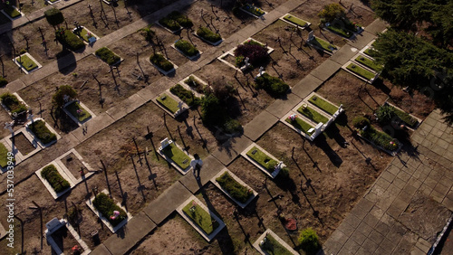 Woman walking in Chacarita Cemetery, Buenos Aires in Argentina. Aerial top-down