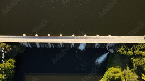 Water passing through dam bulkhead, Cordoba in Argentina. Aerial top-down view