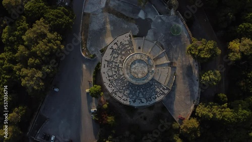 Aerial drone view of abandoned restaurant and viewpoint panoramic building in European art deco style the middle of Monsanto forest in Lisbon Portugal.