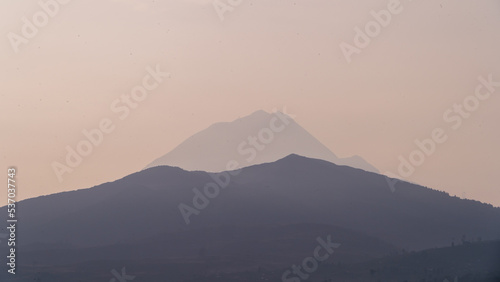 Photograph of a sunrise over the mountains, first ray of sun