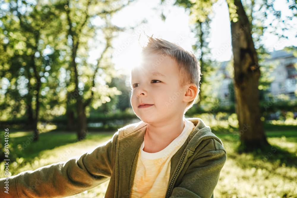 Portrait of boy in park on nature. Portrait of boy in park on nature.