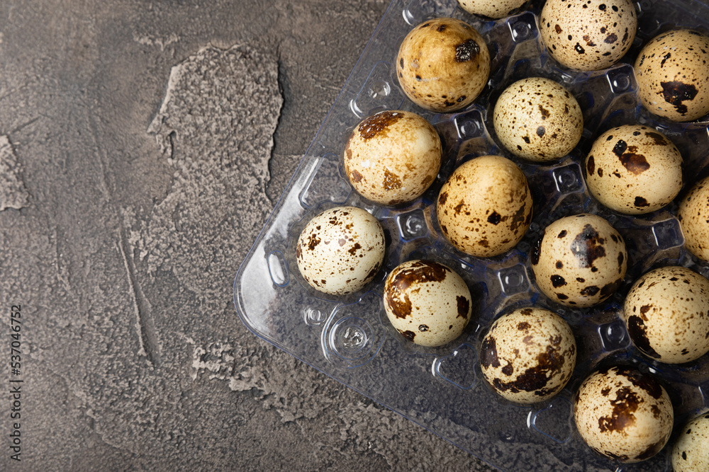 Quail eggs on black texture background. Whole and broken quail eggs. Natural products. Place for text. Fresh quail eggs. Protein. Calcium. Quail eggs on black texture background. Whole and broken quail eggs. Natural products. Place for text. Fresh quail eggs. Protein. Calcium.