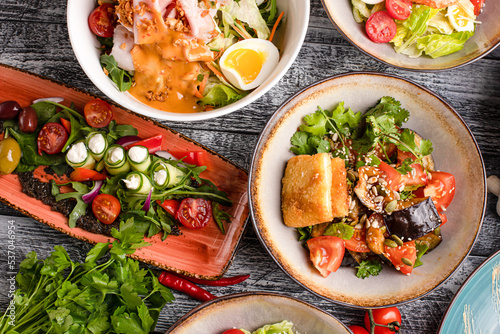 Several types of salads, many salads on a white background, side view