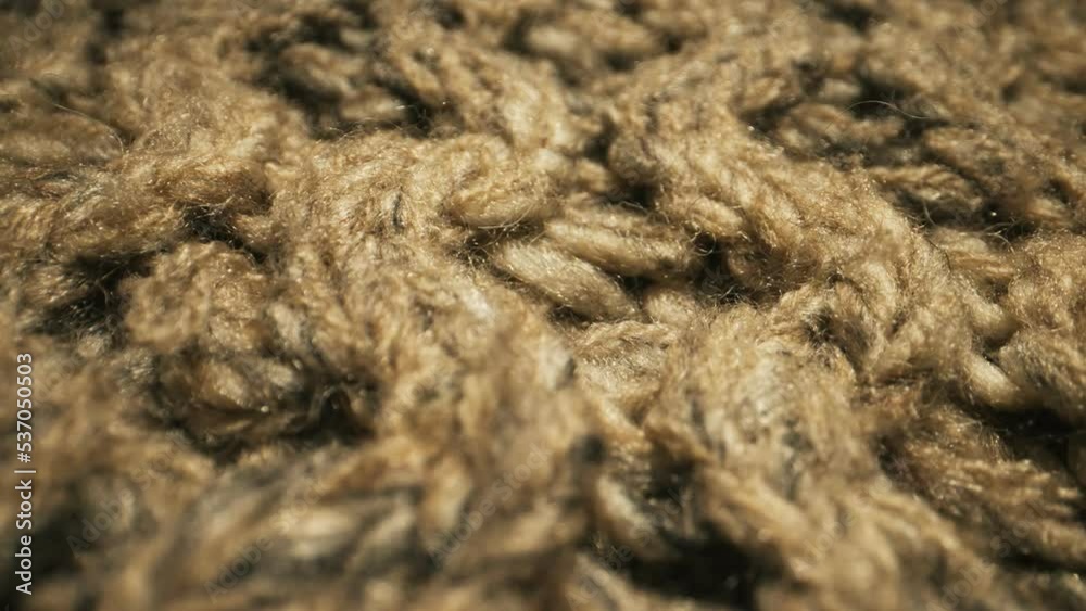 Knitted warm wool fabric texture. Close-up. Knitted warm wool fabric texture. Close-up.