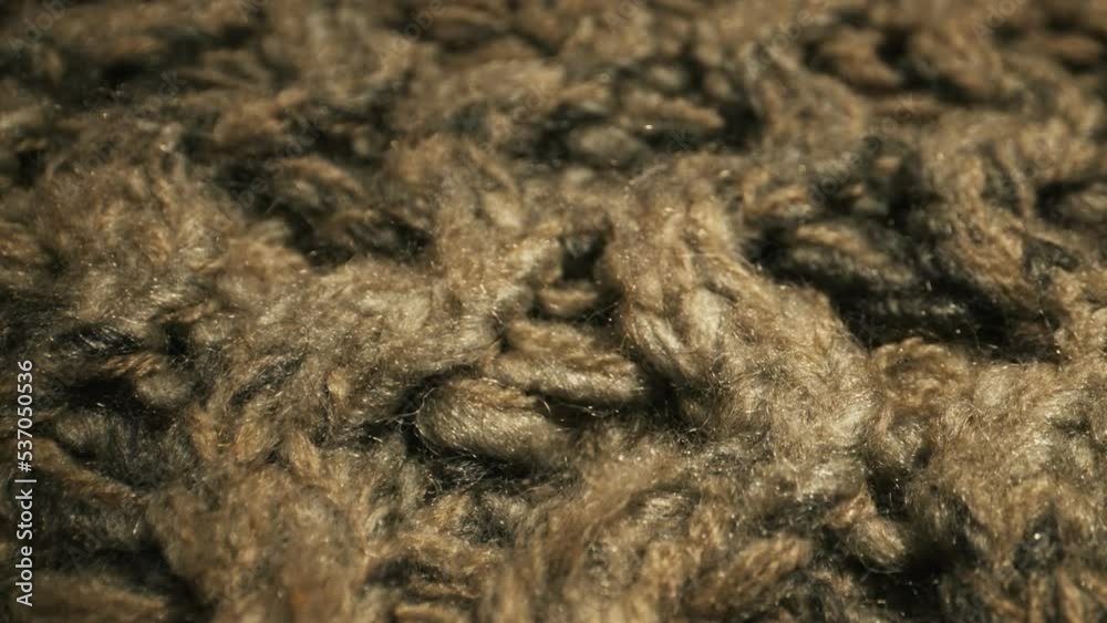 Knitted warm wool fabric texture. Close-up. Knitted warm wool fabric texture. Close-up.