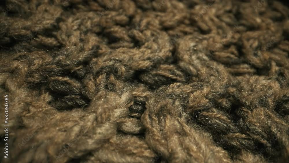 Knitted warm wool fabric texture. Close-up. Knitted warm wool fabric texture. Close-up.