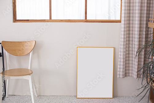 Blank photo frame at the wall