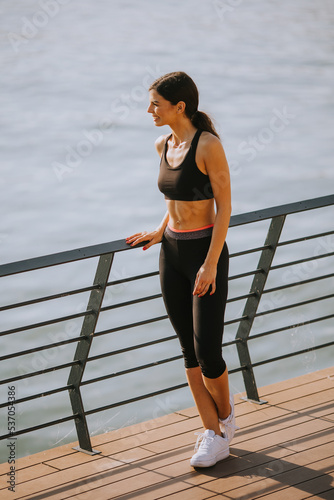 Pretty young woman taking a...