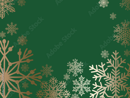 golden snowflakes on dark green ground with space for text background