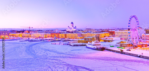 View of the icy harbor at dusk in winter in Helsinki, Finland.