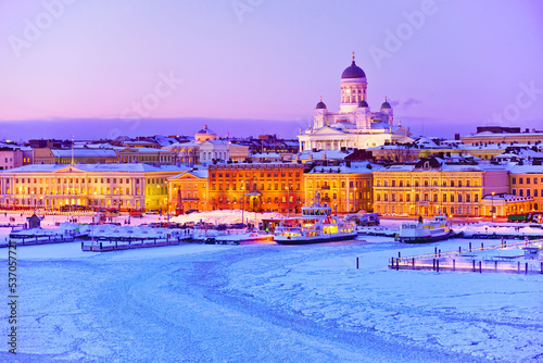 View of the icy harbor at dusk in winter in Helsinki, Finland. photo