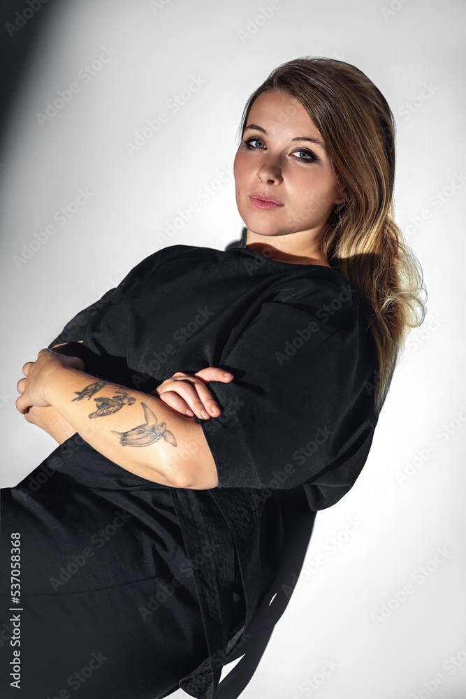 Fototapeta premium Photos of a beautiful girl in the studio under different lighting schemes. Suitable for covers and advertisements