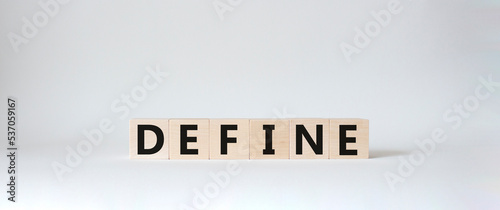 Define symbol. Concept word Define on wooden cubes. Beautiful white background. Business and Define concept. Copy space.