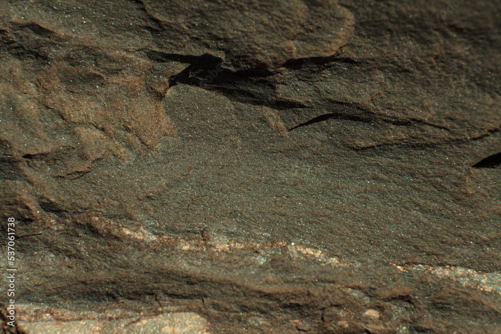 Photo of the texture of natural stone. The heterogeneous background of dark stone Photo of the texture of natural stone. The heterogeneous background of dark stone