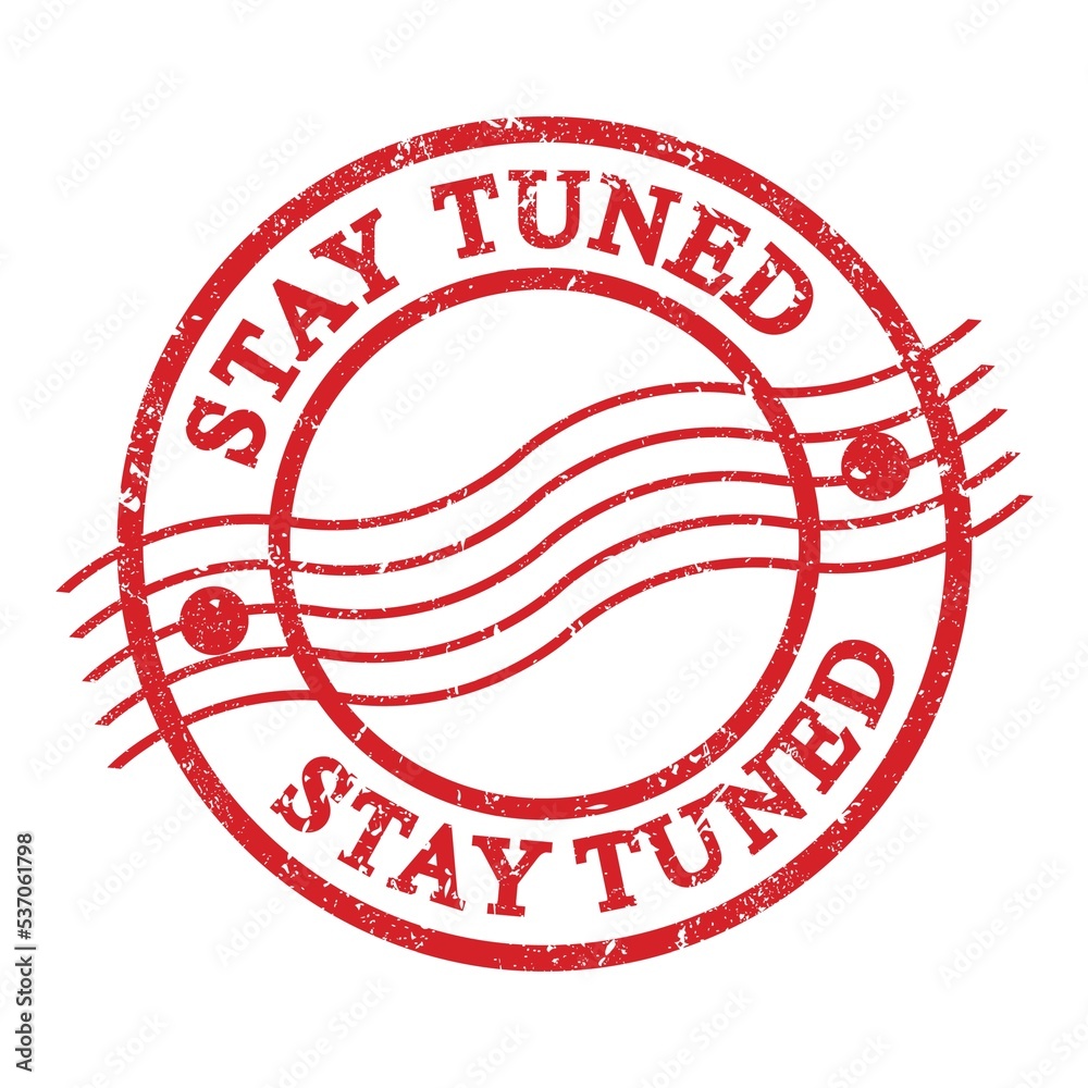 STAY TUNED, text written on red postal stamp. STAY TUNED, text written on red postal stamp.