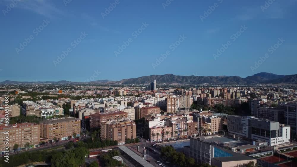 Aerial shot of the city of Murcia from bottom to top, we see two skyscrapers in the center of the image and the camera rises, discovering parks and avenues, in the background we see the orchard Aerial shot of the city of Murcia from bottom to top, we see two skyscrapers in the center of the image and the camera rises, discovering parks and avenues, in the background we see the orchard