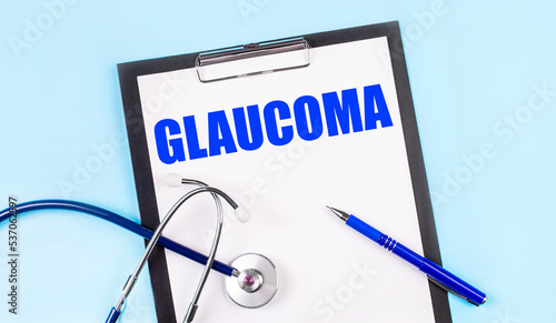 Wallpaper Mural On a blue background, a stethoscope, a pen and a tablet with paper and the text GLAUCOMA. Medical concept Torontodigital.ca