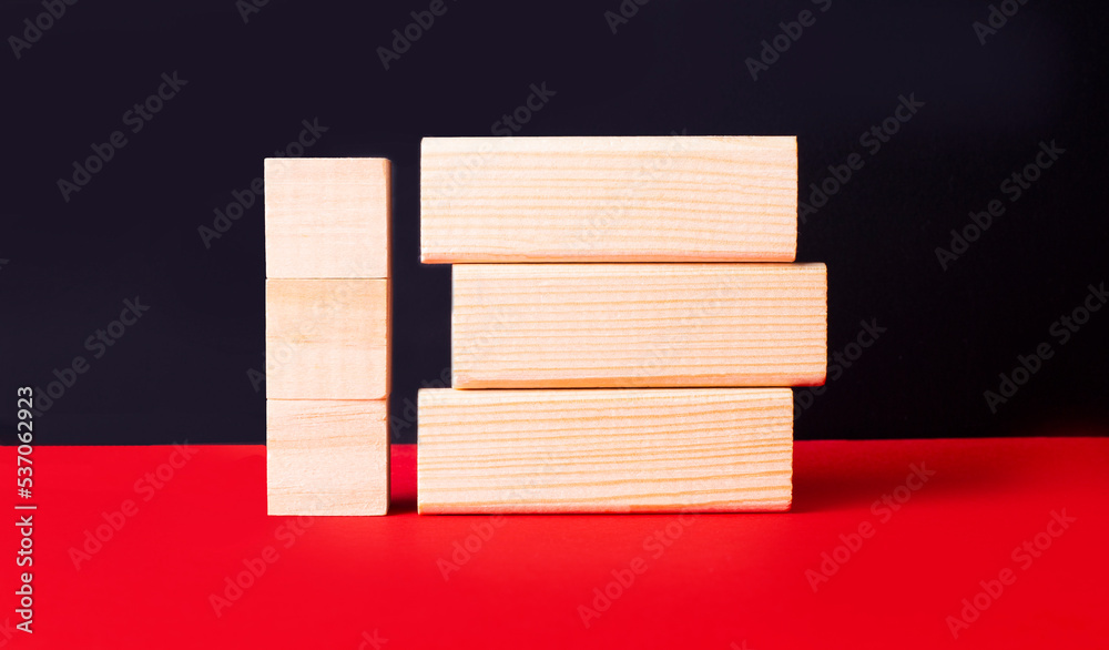 On a black and red background, wooden cubes and blocks with a place to insert text On a black and red background, wooden cubes and blocks with a place to insert text