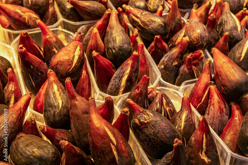 Background with black figs on display at the market