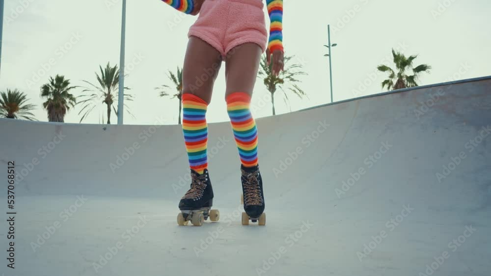 Beautiful woman skating with roller skates and having fun. Professional skater and dancer training in the morning