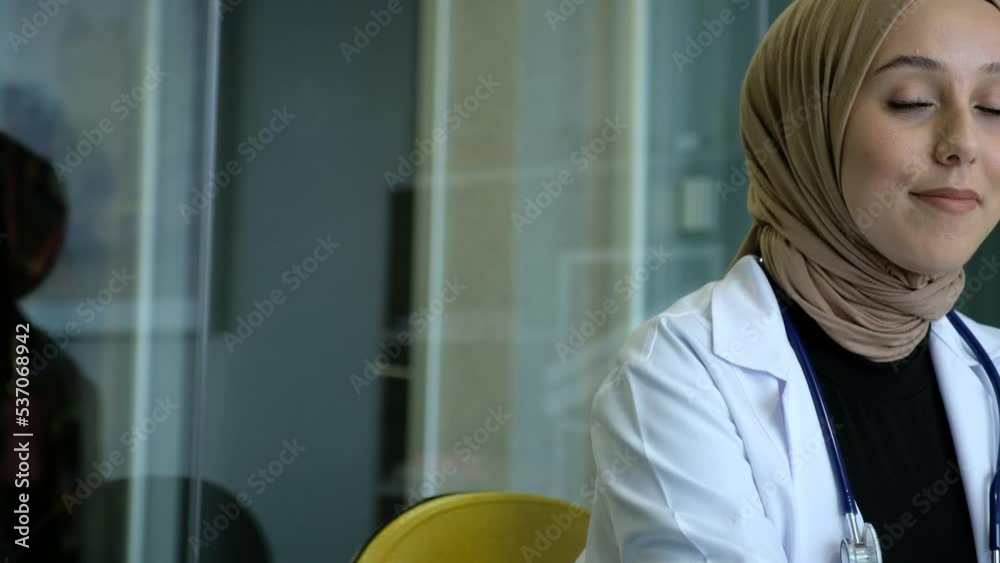 doctor standing in front of a computer doctor standing in front of a computer