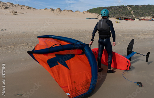 person wind foiling in tarifa