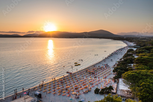Aerial view of people on the beach in Alghero, Sardinia, Italy. photo
