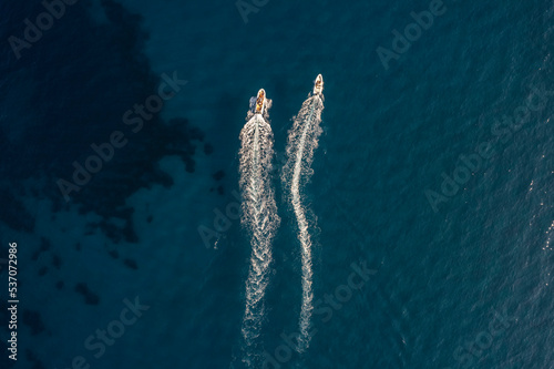 Aerial view of a motorboat sailing in the sea, Zonza, Corse, France. photo