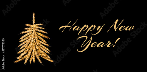 Creative Christmas tree made of wheat ears.The inscription  Happy New Year   on a black background.Creative New Year s flat lay.