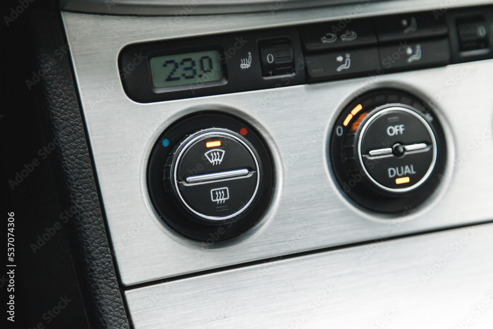 Illuminated button for activated dual-zone climate control and windshield defrost in the car. Illuminated button for activated dual-zone climate control and windshield defrost in the car.