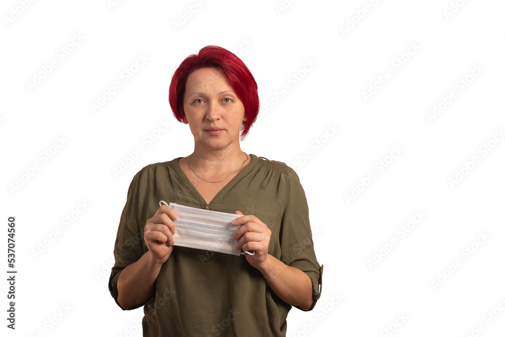 a woman holds a protective medical mask. isolated on a white background. a woman holds a protective medical mask. isolated on a white background.