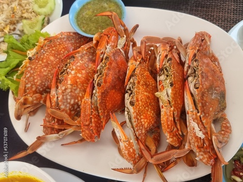 Steamed crab, eaten with seafood sauce (sweet, spicy, sour)