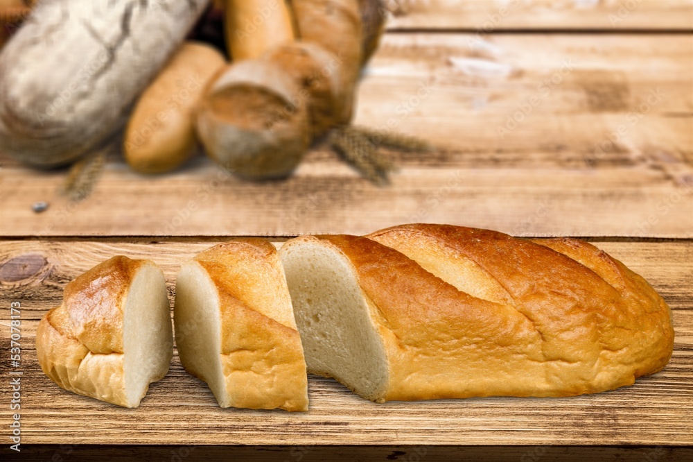 Tasty fresh bakery bread sliced on the desk