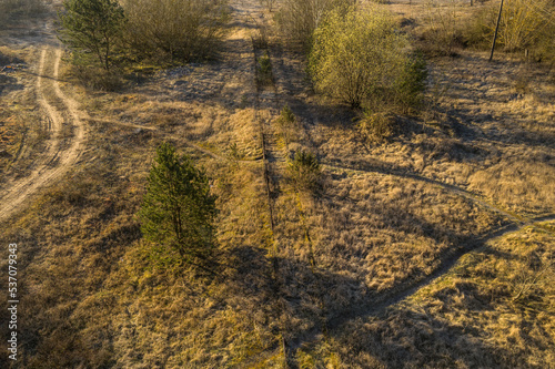 Drone photography of old rusty railroad overgrown by plants